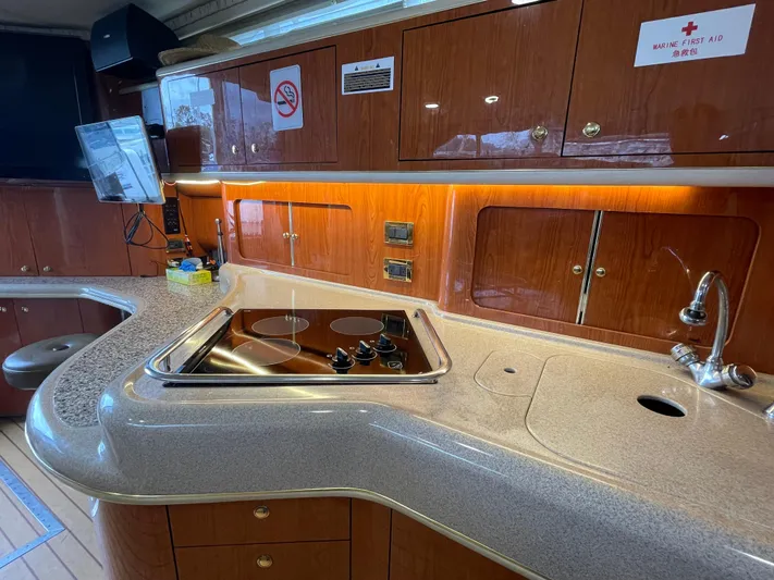  Yacht Photos Pics Luxurious kitchen area in a 2000 Sea Ray 450 Express Bridge yacht.