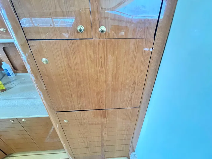  Yacht Photos Pics Wooden cabinetry inside a 2000 Sea Ray 450 Express Bridge yacht.