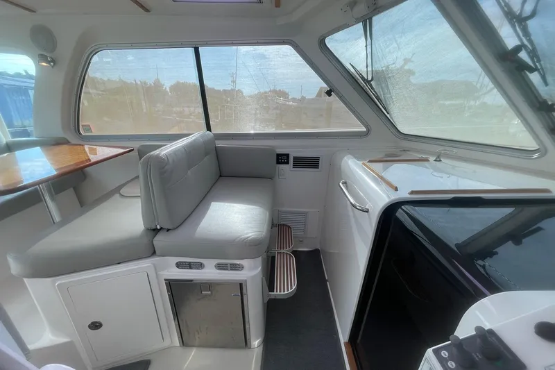 Merroir Yacht Photos Pics Interior of a 2014 Back Cove 34 boat with seating and windows.