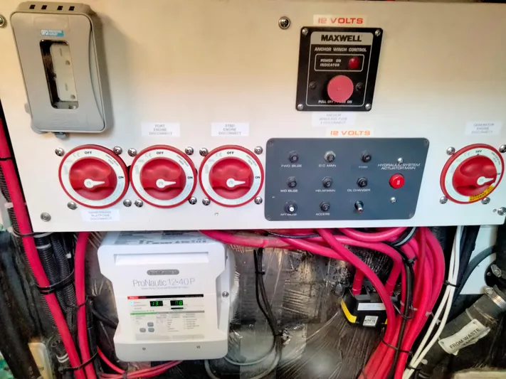 Ancora Yacht Photos Pics Electrical panel of a 1997 Tiara Yachts 40' Tiara Express with red switches and wiring.