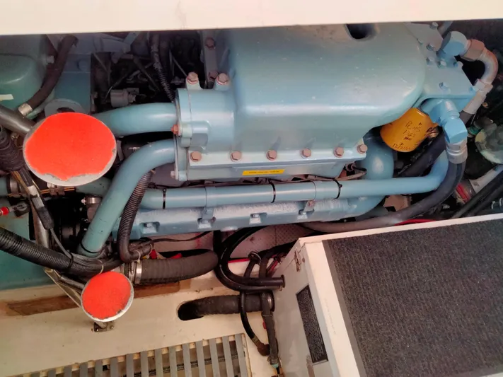 Ancora Yacht Photos Pics Engine compartment of a 1997 Tiara Yachts 40' Tiara Express, showcasing mechanical components.