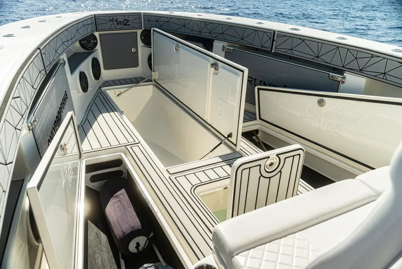  Yacht Photos Pics 2019 SeaVee 390Z boat interior with open storage compartments on a sunny day.