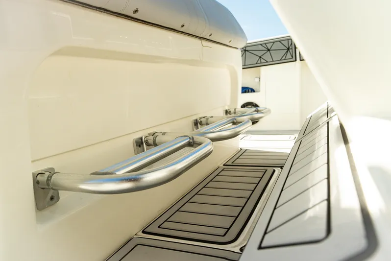  Yacht Photos Pics 2019 SeaVee 390Z boat interior with stainless steel handrails and cushioned seating.