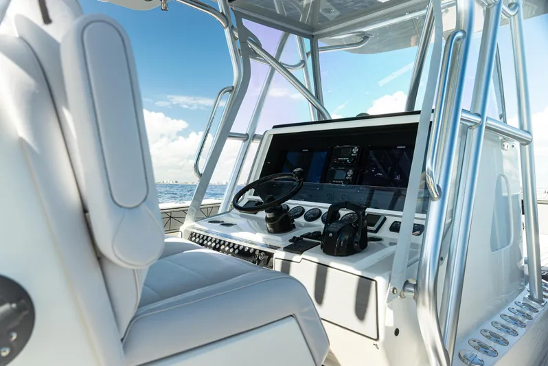  Yacht Photos Pics 2019 SeaVee 390Z boat cockpit with steering wheel and navigation equipment.