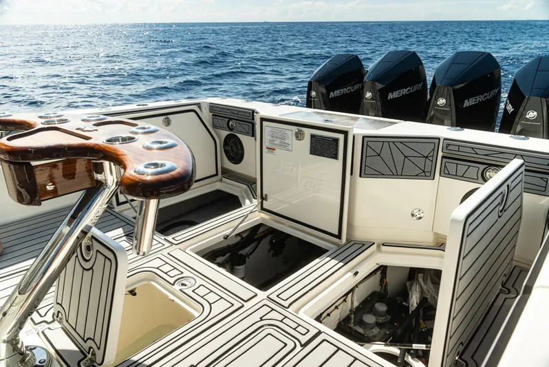  Yacht Photos Pics 2019 SeaVee 390Z boat deck with Mercury engines, open compartments, and ocean backdrop.