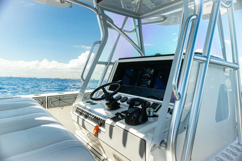  Yacht Photos Pics 2019 SeaVee 390Z boat cockpit with ocean view and modern controls.