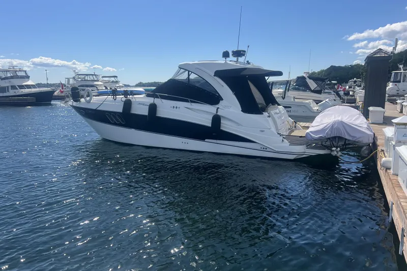  Yacht Photos Pics 2010 Cruisers Yachts 360 Express docked at marina on a sunny day.