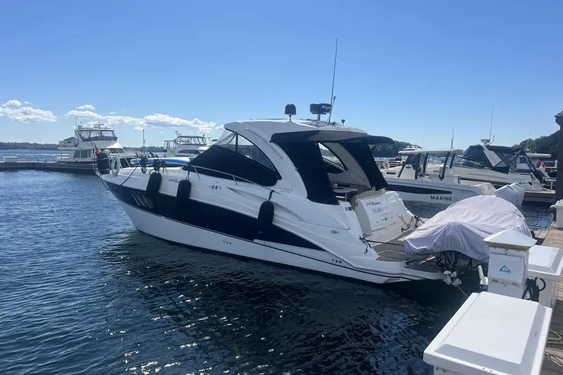  Yacht Photos Pics 2010 Cruisers Yachts 360 Express docked at marina under clear blue sky.