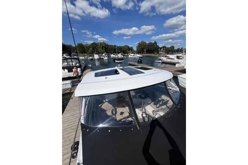  Yacht Photos Pics 2010 Cruisers Yachts 360 Express docked at marina under blue sky.