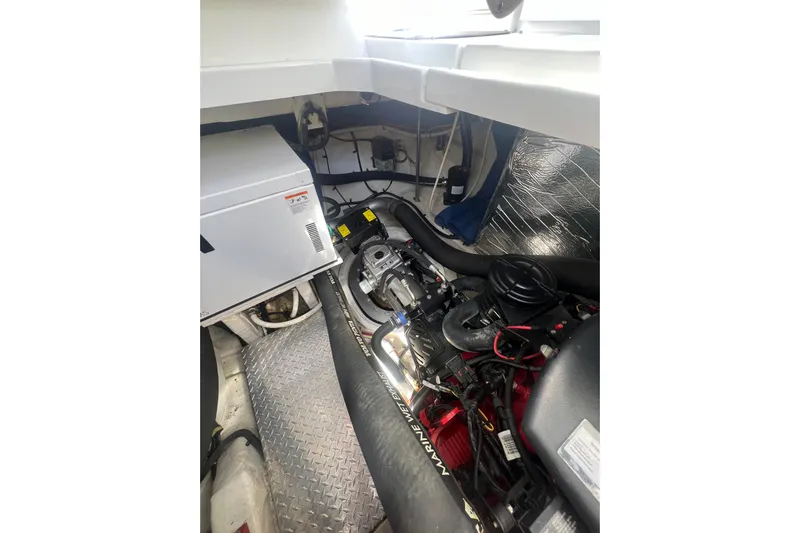  Yacht Photos Pics Engine compartment of 2010 Cruisers Yachts 360 Express, showcasing mechanical components and wiring.