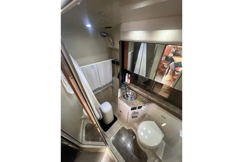  Yacht Photos Pics 2010 Cruisers Yachts 360 Express bathroom with shower, sink, and toilet.