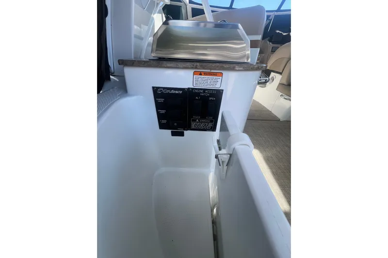  Yacht Photos Pics 2010 Cruisers Yachts 360 Express interior, featuring control panel and seating area.