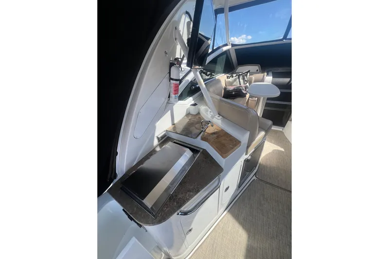  Yacht Photos Pics 2010 Cruisers Yachts 360 Express interior with kitchenette and seating area.