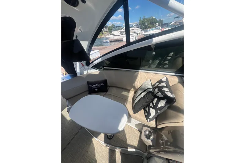  Yacht Photos Pics Interior of 2010 Cruisers Yachts 360 Express with seating and table, dock view.