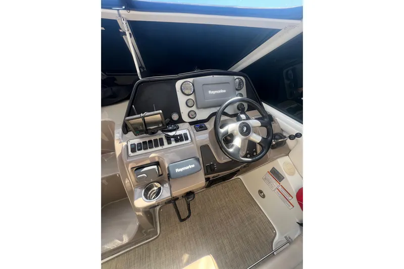  Yacht Photos Pics 2010 Cruisers Yachts 360 Express helm with Raymarine navigation system.