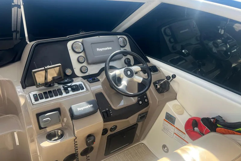  Yacht Photos Pics Helm of 2010 Cruisers Yachts 360 Express with Raymarine navigation system.