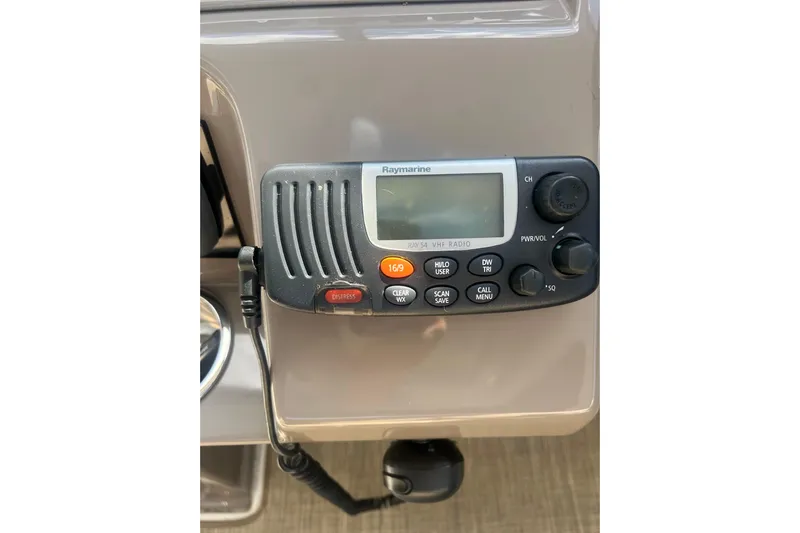  Yacht Photos Pics VHF radio on 2010 Cruisers Yachts 360 Express dashboard, featuring Raymarine model.