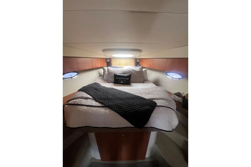  Yacht Photos Pics Luxurious cabin interior of 2010 Cruisers Yachts 360 Express with cozy bedding.