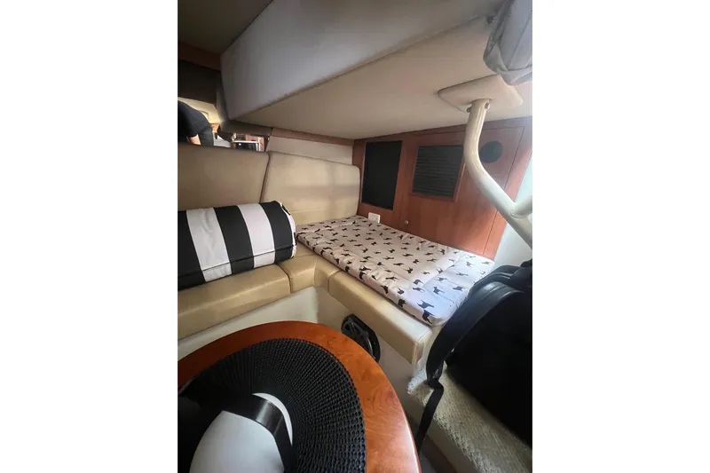  Yacht Photos Pics Interior cabin of 2010 Cruisers Yachts 360 Express with cozy bedding and seating.