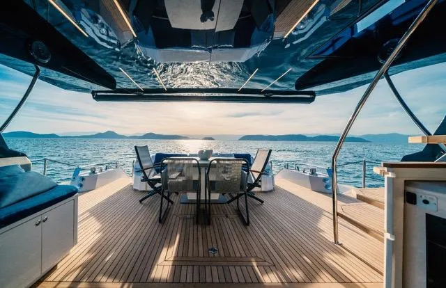  Yacht Photos Pics Luxurious 2020 OKEAN 80 yacht deck with ocean view at sunset.