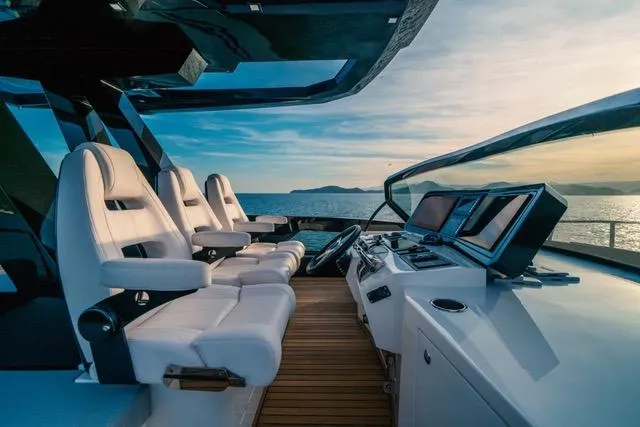  Yacht Photos Pics Luxurious 2020 OKEAN 80 yacht cockpit with modern navigation systems and ocean view.