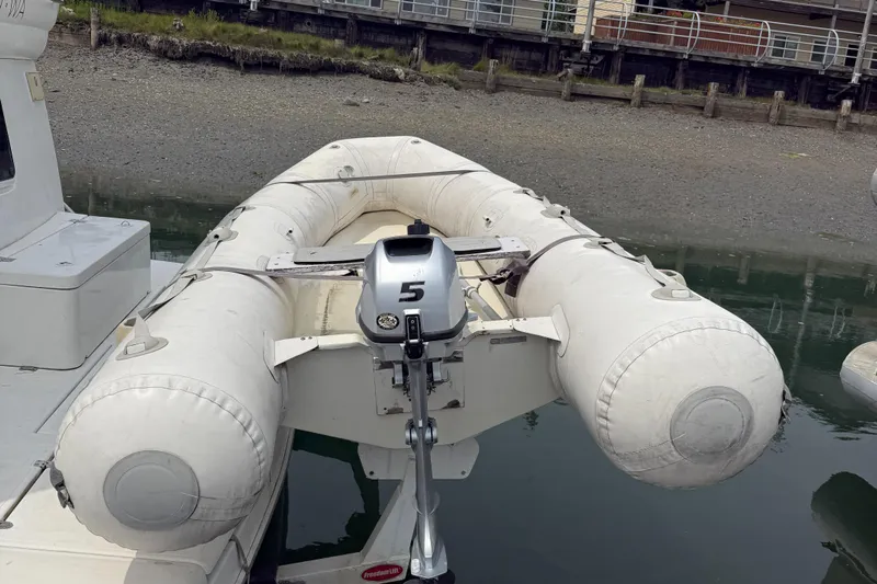  Yacht Photos Pics Inflatable dinghy with outboard motor on 2004 Cruisers Yachts 455 Express Motor Yacht.