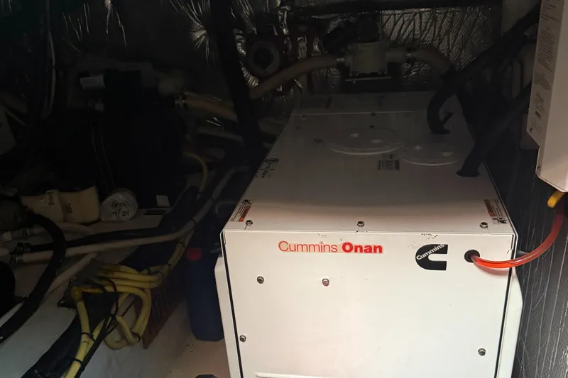  Yacht Photos Pics Engine room of 2004 Cruisers Yachts 455 Express with Cummins Onan generator.