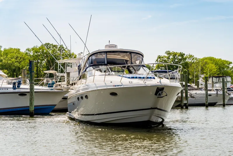  Yacht Photos Pics 2008 Regal Commodore 4060 yacht docked in a marina, surrounded by other boats.