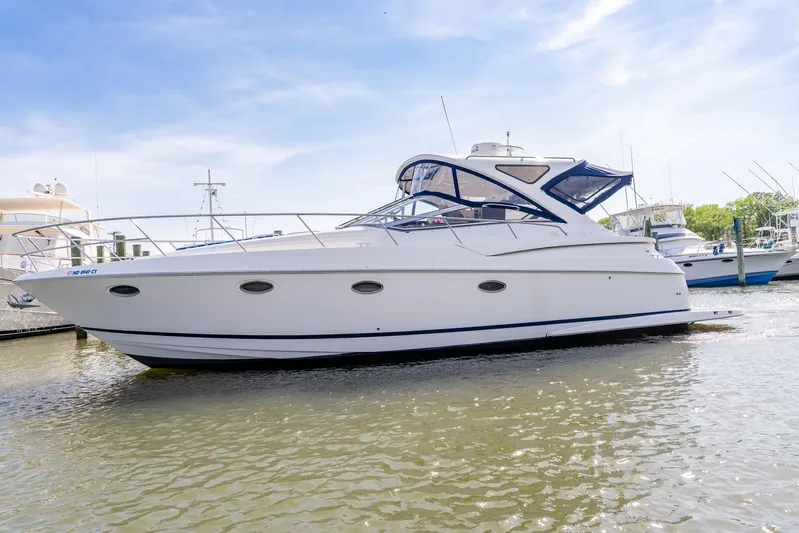  Yacht Photos Pics 2008 Regal Commodore 4060 yacht docked in a marina under a clear blue sky.