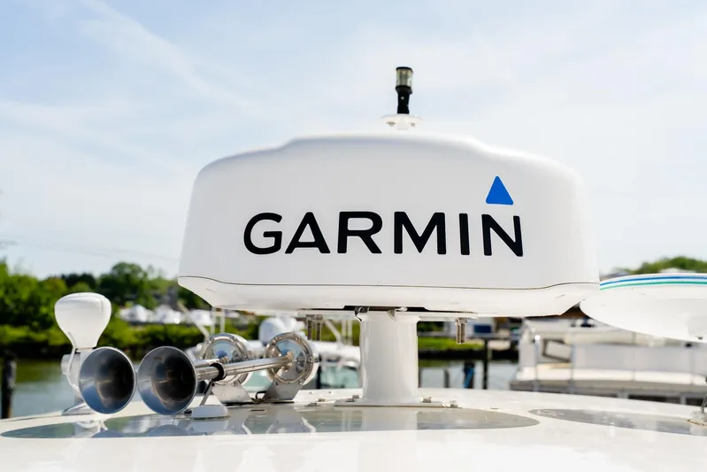  Yacht Photos Pics Garmin radar on 2008 Regal Commodore 4060 yacht, docked with clear sky background.