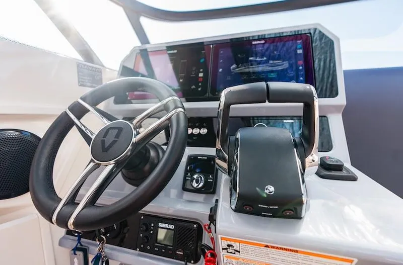  Yacht Photos Pics Steering console of 2025 Navan S30 boat with advanced navigation controls and display.