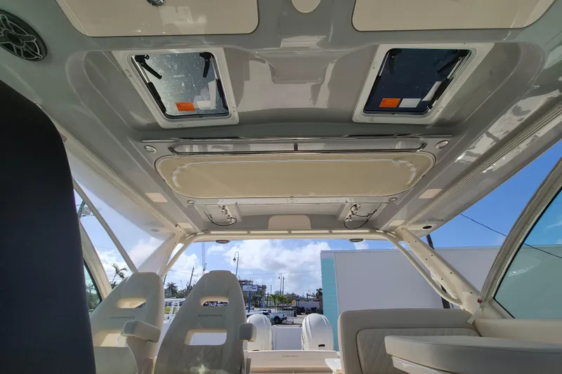 345-624 Yacht Photos Pics Interior view of 2026 Grady-White Freedom 345 boat, featuring seating and ceiling hatches.