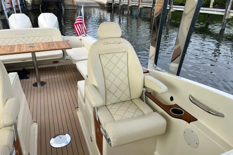  Yacht Photos Pics 2023 Chris-Craft Calypso 30 interior with luxurious seating and elegant wood accents.