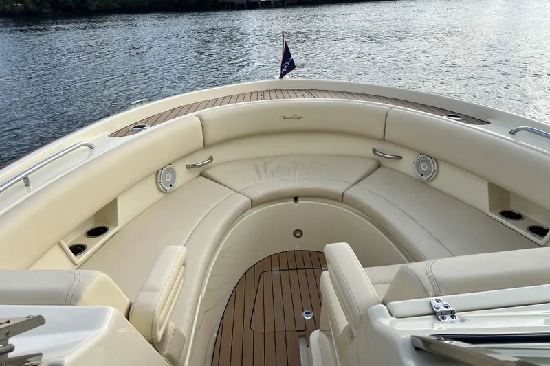  Yacht Photos Pics 2023 Chris-Craft Calypso 30 boat interior with luxurious seating and wood accents.