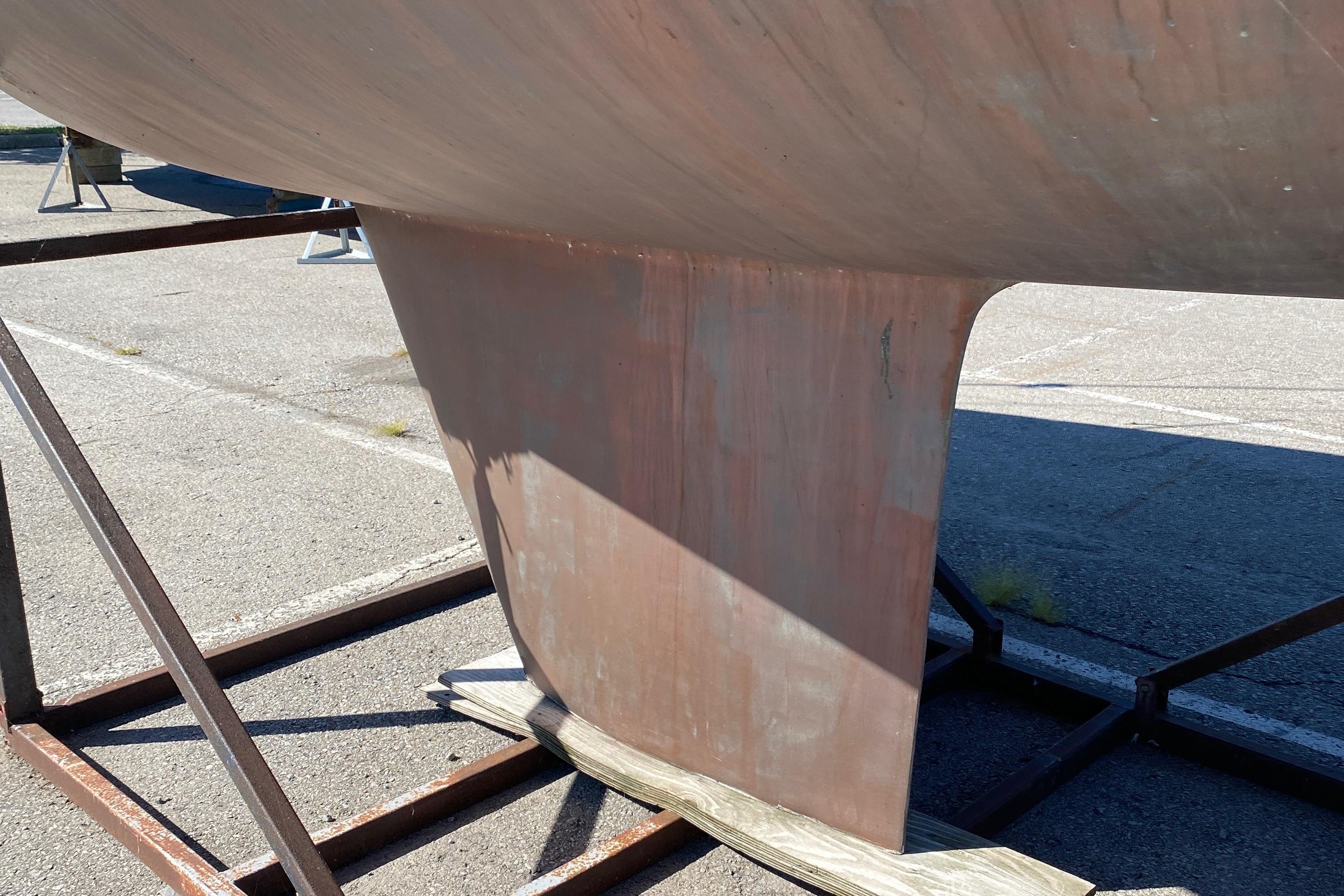 1985 CS 33 Sloop keel on dry dock, showcasing hull structure.