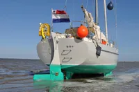 Sailing yacht Puffin 30 (9M) Sloop generation 2, 2012, in shallow water with Dutch flag.