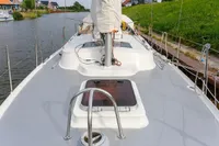 Sailing yacht Puffin 30 (9M) Sloop, 2012 model, docked on a calm waterway.