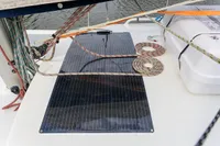 Solar panel on Puffin 30 Sloop sailboat deck, surrounded by ropes and equipment.