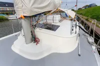 Sailboat deck of 2012 Puffin 30 Sloop, docked by a canal.