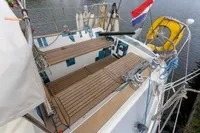 Cockpit of 2012 Puffin 30 Sloop with wooden deck and nautical equipment.