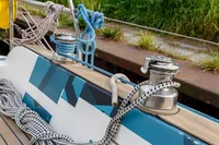 Close-up of ropes and winches on a 2012 Puffin 30 Sloop sailboat deck.
