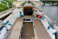 Cockpit of 2012 Puffin 30 Sloop, featuring teak decking and nautical equipment.