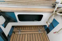 Cockpit of 2012 Puffin 30 Sloop with wooden flooring and nautical ropes.