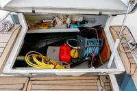 Storage compartment of 2012 Puffin 30 Sloop with boating equipment and supplies.