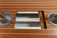 Wooden deck with metal fixtures on a 2012 Puffin 30 (9M) Sloop.