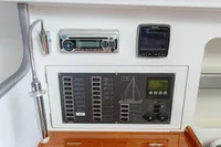 Control panel of 2012 Puffin 30 Sloop, featuring navigation and audio systems.