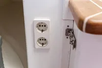 Electrical outlets on Puffin 30 Sloop, 2012 model, with wooden trim detail.