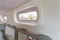 Interior view of 2012 Puffin 30 Sloop, featuring sleek windows and modern design.