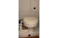 Marine toilet in a 2012 Puffin 30 Sloop, featuring a Jabsco pump system.