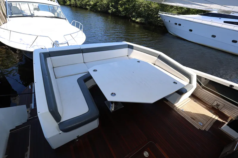  Yacht Photos Pics Luxurious 2019 Galeon 650 Sky yacht with spacious outdoor seating and table.